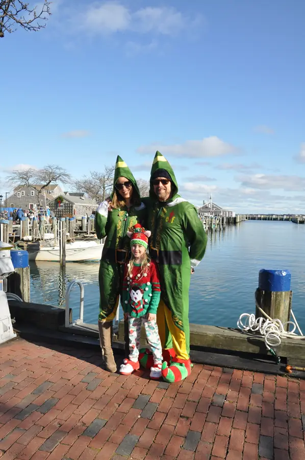 Family in elf costumes on the wharf