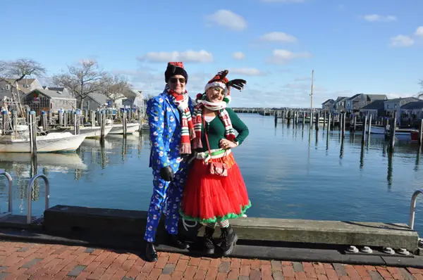Couple in festive outfits by the harbor